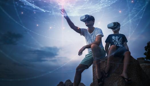 Man and boy using VR headset